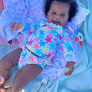 Malia joined the competition — help win amazing prizes! baby, bed, blanket, bodypart, clothing, dress, face, finger, furniture, hand, happy, hat, head, newborn, person, photography, portrait, purple, quilt, smile