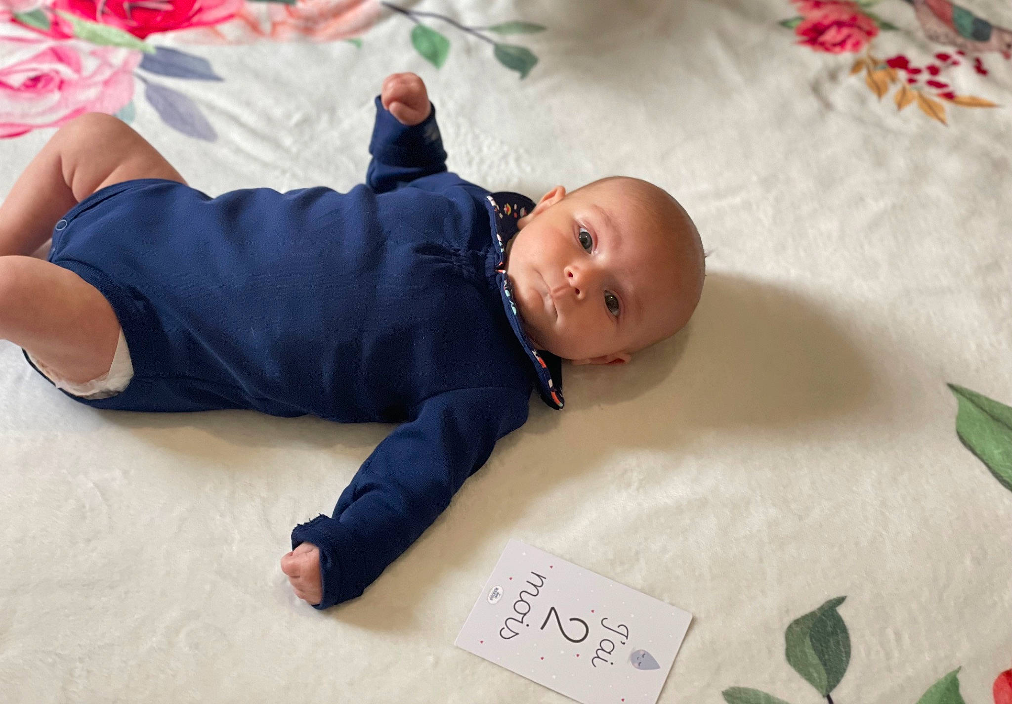 Maya participe au concours pour gagner de l'argent avec cette photo : baby, baby_toddler_clothing, child, comfort, facial_expression, flooring, foot, fun, handwriting, happy, head, knee, linens, mammal, person, room, skin, sleeve, textile, toddler