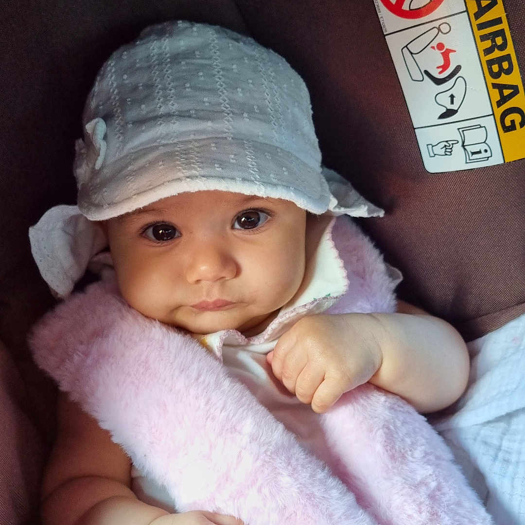 Hala joined the competition — help win amazing prizes! airbag, baby, car, car_seat, child, clothing, cute, face, hand, hat, infant, pink, portrait, safety_belt, seatbelt, skin, strap, warning_label, white, young