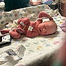 newborn, baby, hospital, blanket, medical_equipment, infant, id_band, sleeping, person, hand, healthcare, bed, clinic, patient, care, pink_skin, diaper, hospital_room, towel, resting