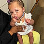 Elyse joined the competition — help win amazing prizes! baby, girl, child, purple_bows, white_dress, white_sandals, medical_tube, indoor, person, hand, floor, carpet, curious, sitting, holding, skin, hair, face, expression, lap