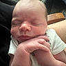 Ryder is registered to the contest to win money with this photo: baby, newborn, sleeping, face, hand, onesie, infant, skin, closeup, resting, soft, cute, child, person, peaceful, indoors, plush, cushion, headband, portrait