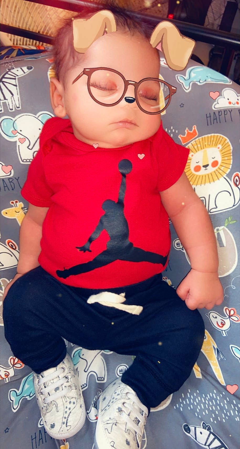 Kayden is registered to the contest to win money with this photo: arm, baby_toddler_clothing, cheek, cool, doll, electric_blue, eyewear, fictional_character, fun, happy, human_body, person, pink, red, sleeve, t_shirt, textile, thigh, toddler, toy