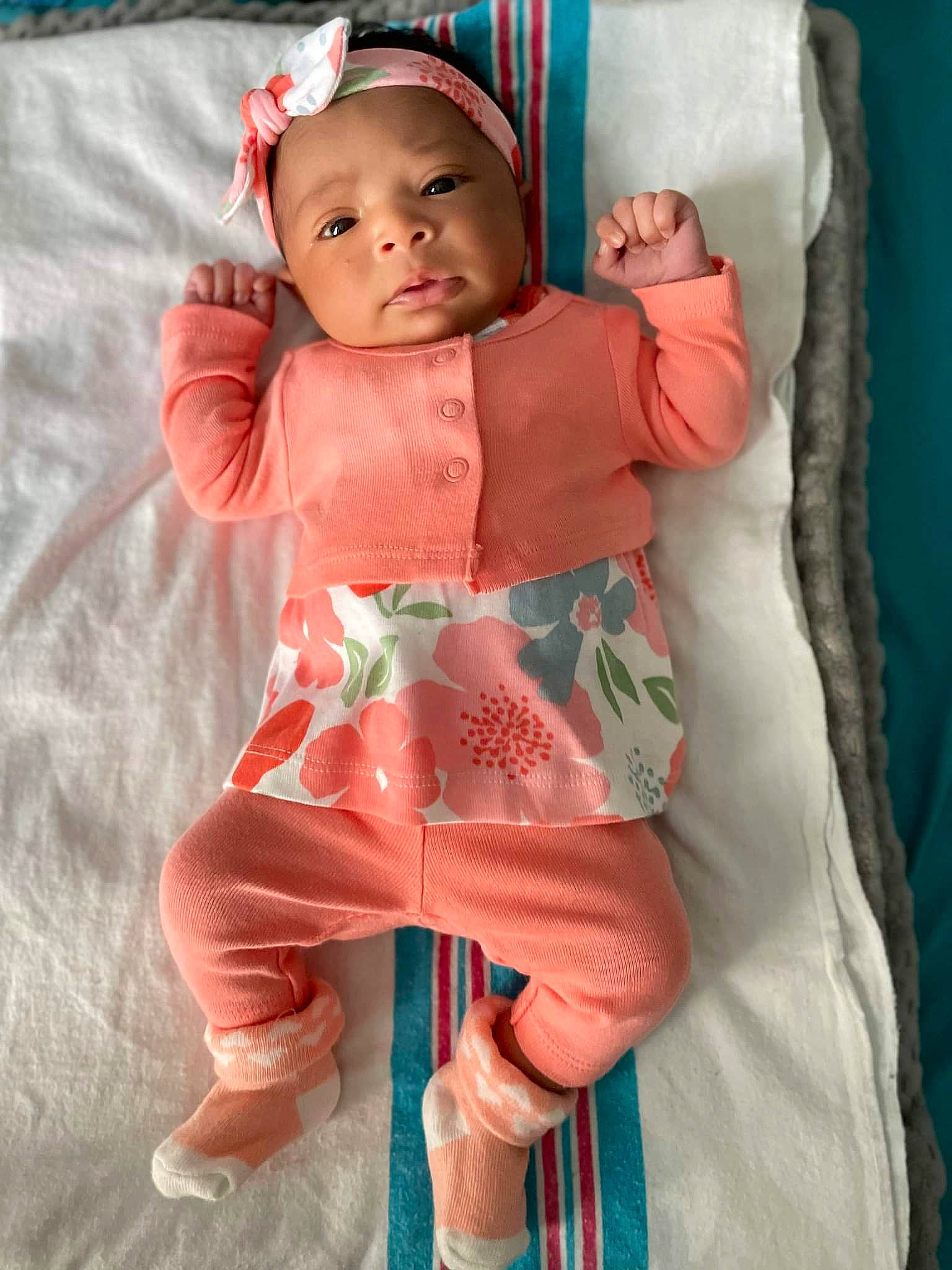 Kimora joined the competition — help win amazing prizes! baby, baby_toddler_clothing, child, comfort, eye, face, foot, head, headwear, human_leg, leg, linens, neck, person, pink, skin, sleeve, sock, textile, thigh