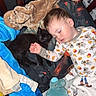 baby, black_cat, blanket, child, comfort, cozy, crib, cuddling, cute, indoors, infant, kitten, nap, pajamas, peaceful, pet, plush_toy, rest, sleeping, soft_toys