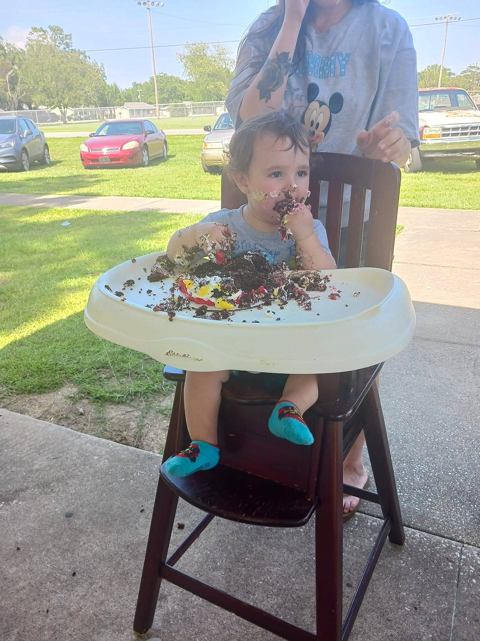 Waylon Mcvay is registered to the contest to win money with this photo: automotive_exterior, automotive_wheel_system, car, chair, event, fun, grass, landscape, lawn, leisure, motor_vehicle, outdoor_furniture, outdoor_table, person, plant, recreation, sky, table, tire, tree