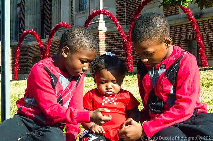 Oriana is registered to the contest to win money with this photo: adaptation, black, event, eye, fun, grass, hairstyle, happy, human, human_settlement, interaction, leisure, people, people_in_nature, person, public_space, recreation, red, sharing, temple