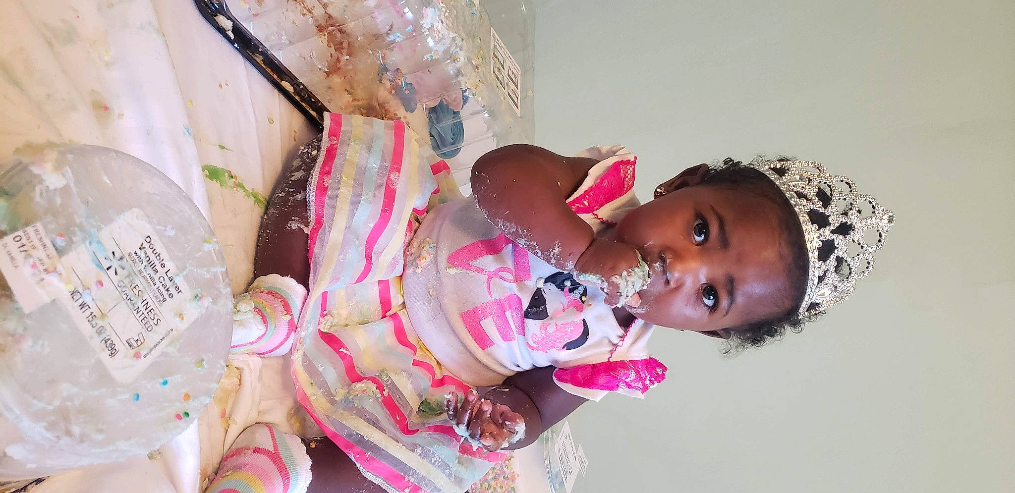 Oriana is registered to the contest to win money with this photo: baby, baby_toddler_clothing, child, dress, event, eyelash, fashion_design, fun, happy, hat, human_body, jewellery, magenta, party, pattern, person, pink, room, skin, textile