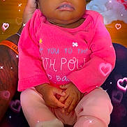 Royalty is registered to the contest to win money with this photo: baby, sleeping, pink_clothing, socks, hands, tattoo, arm, sparkles, hearts, adult_hand, infant, cute, closeup, portrait, indoors, soft_lighting, peaceful, resting, child, person