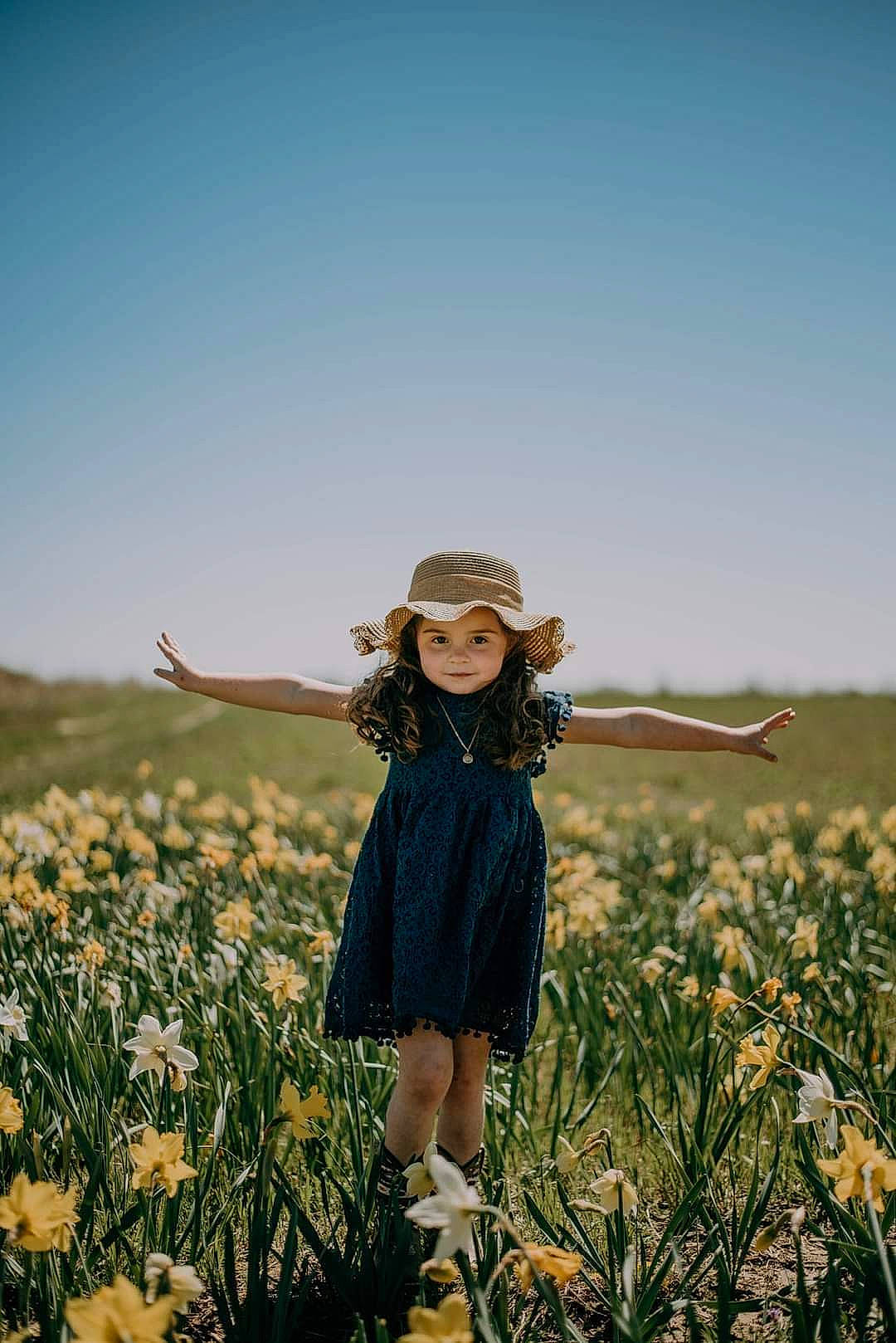 Alannah is registered to the contest to win money with this photo: agriculture, ecoregion, fawn, flower, grass, grass_family, grassland, happy, hat, landscape, long_hair, meadow, natural_landscape, people_in_nature, petal, plant, sky, sun_hat, sunglasses, sunlight