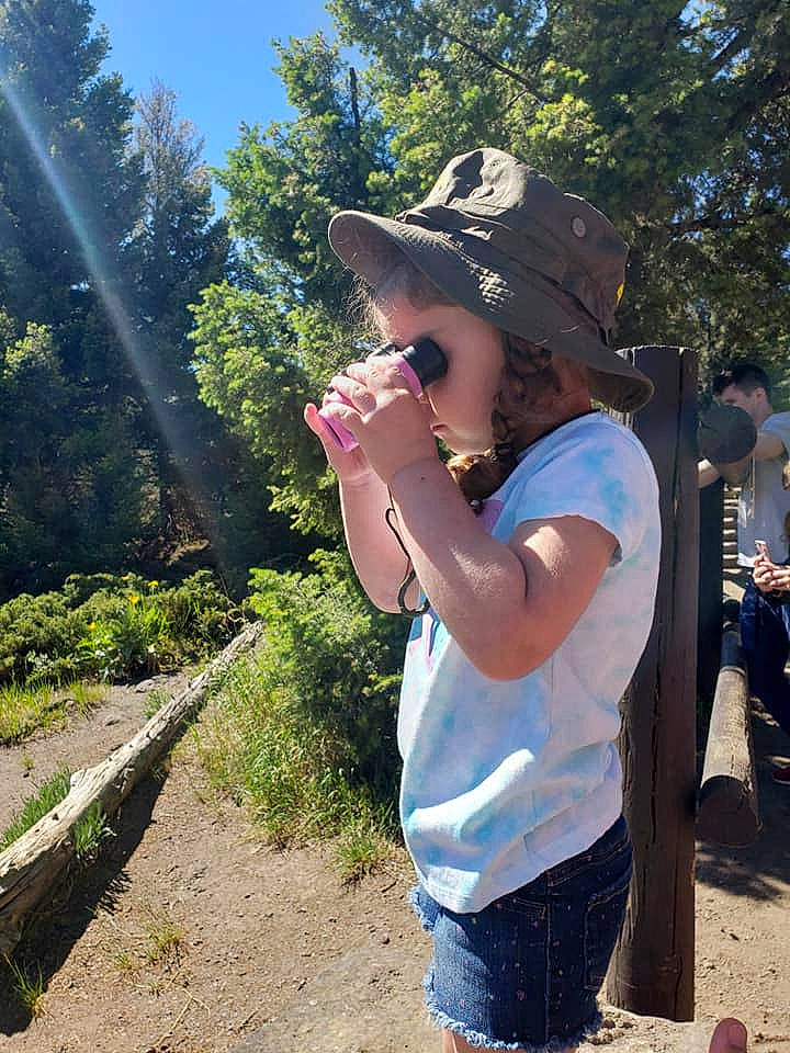 Alannah joined the competition — help win amazing prizes! baseball_cap, cap, chair, eyewear, fedora, finger, gesture, grass, hat, landscape, leisure, person, plant, recreation, shorts, sky, summer, sun_hat, t_shirt, travel