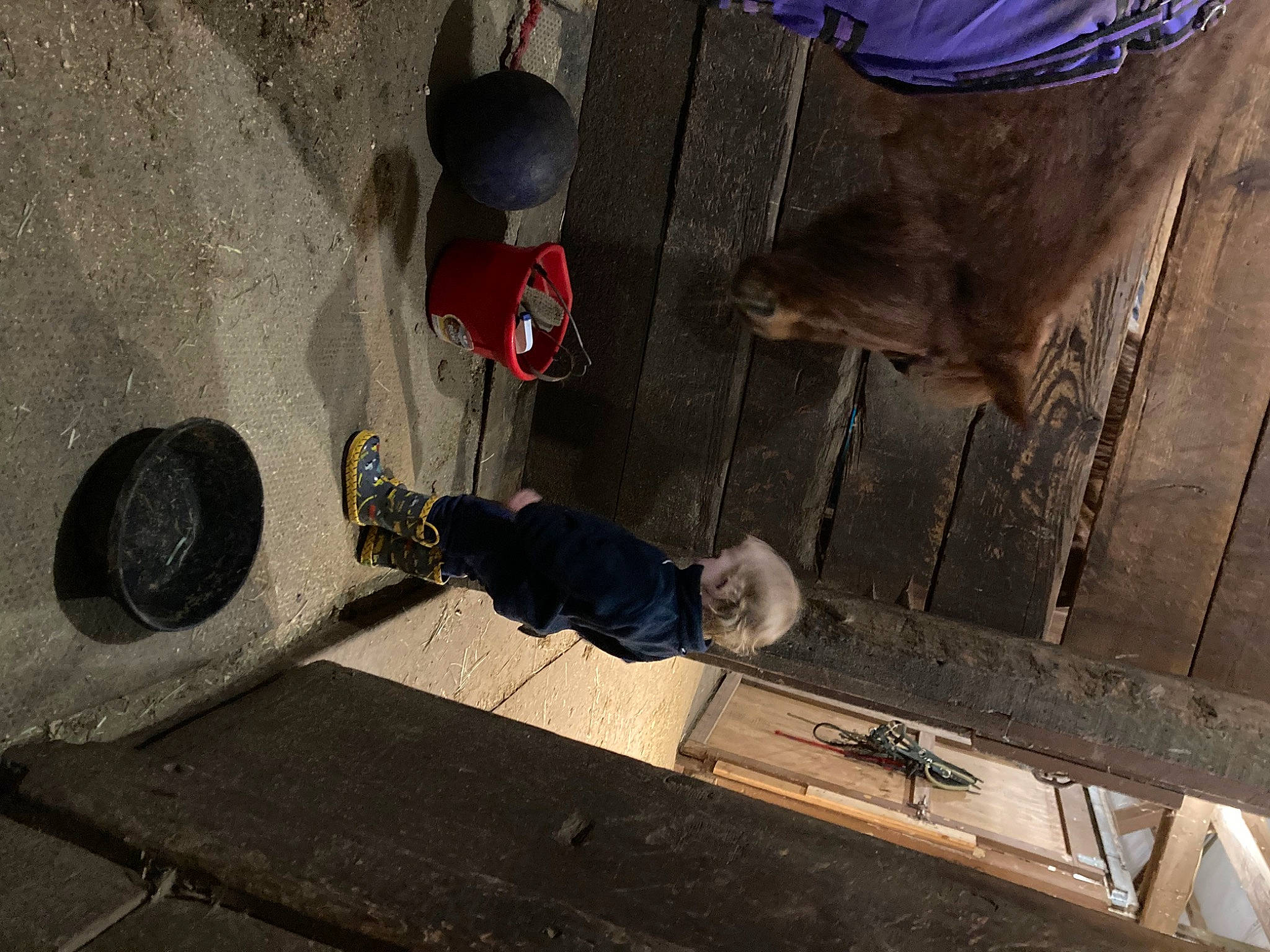 Jackson is registered to the contest to win money with this photo: asphalt, auto_part, automotive_tire, automotive_wheel_system, concrete, floor, flooring, gas, hat, metal, outdoor_shoe, pedestrian, person, recreation, road, road_surface, shadow, sidewalk, tire, toddler