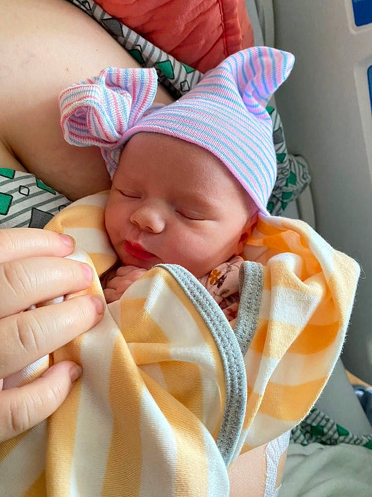 Charlotte is registered to the contest to win money with this photo: baby, baby_products, baby_sleeping, baby_toddler_clothing, child, comfort, finger, headwear, linens, nail, pattern, peach, person, skin, thigh, thumb, toddler