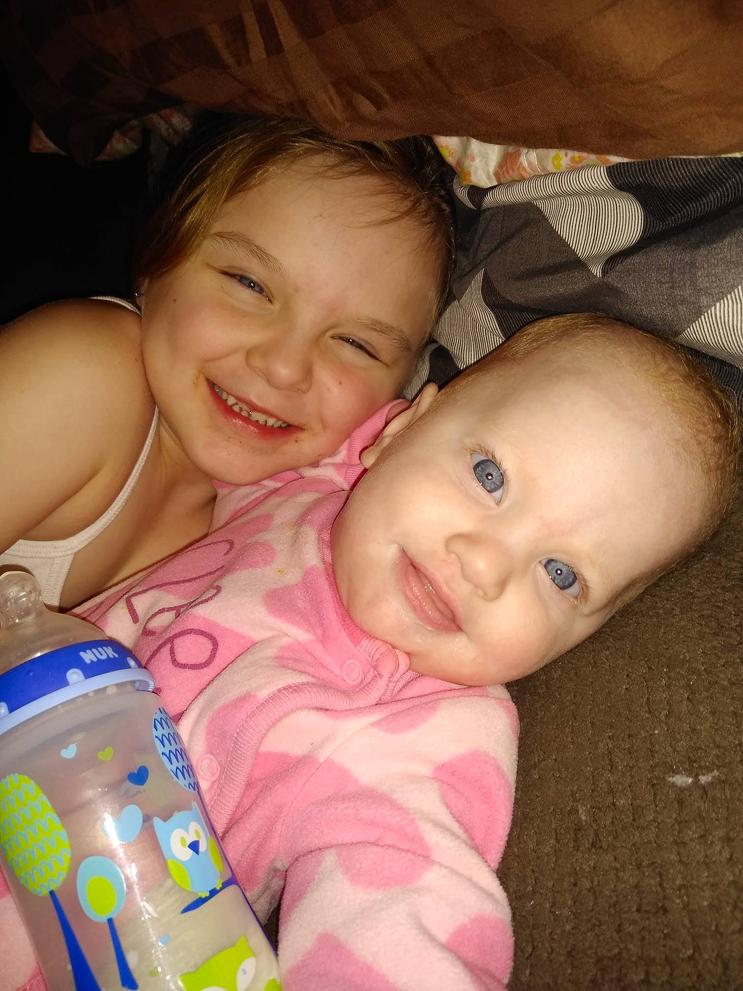 Rosie is registered to the contest to win money with this photo: cheek, child, daughter, day, eye, face, finger, fun, girl, head, infant, iris, joy, mother, mouth, nose, person, pink, product, skin