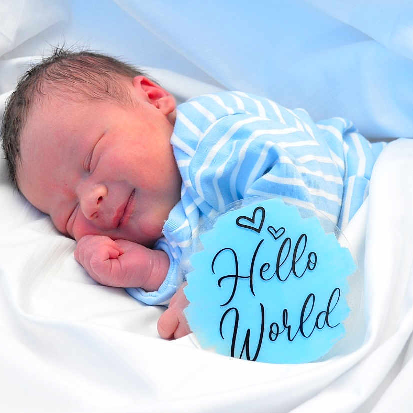 Noah joined the competition — help win amazing prizes! architecture, baby, bed, blanket, bodypart, building, clothing, cradle, face, furniture, glove, head, hospital, newborn, person, photography, portrait, quilt, sleeping, text