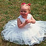 toddler, child, grass, outdoor, white_dress, tulle, pink_bows, hair_accessories, sunlight, smiling, cute, sitting, young_child, baby_shoes, innocence, happy, portrait, people, person, nature