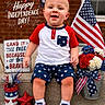 baby, child, infant, smiling, portrait, independence_day, american_flag, patriotic, red_white_blue, fireworks, stars, flowers, outdoor, brick_wall, steps, sitting, clothing, sneakers, holiday_decoration, text_overlay