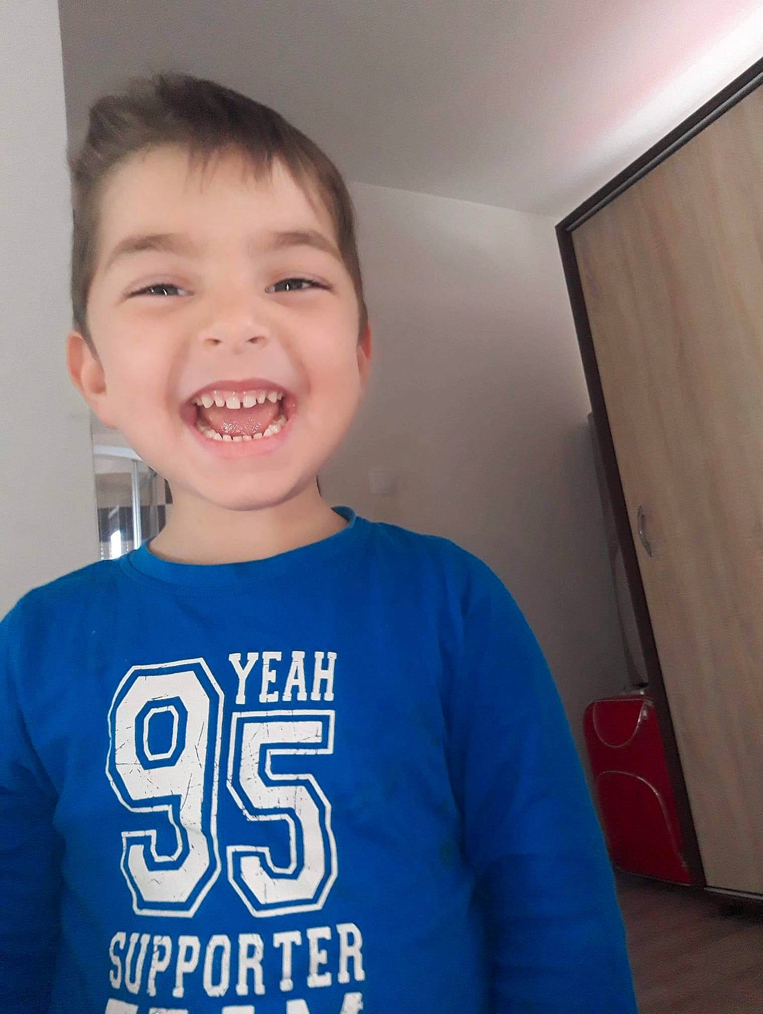 Denis joined the competition — help win amazing prizes! blue, child, chin, face, facial_expression, forehead, happy, head, joy, laugh, organ, person, sleeve, smile, standing, t_shirt, toddler, tooth, top