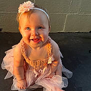 Mylee is registered to the contest to win money with this photo: baby, child, smiling, blue_eyes, headband, flower, pink_dress, tutu, sitting, barefoot, happy, cute, portrait, indoors, soft_light, shadow, infant, young_child, human, apparel