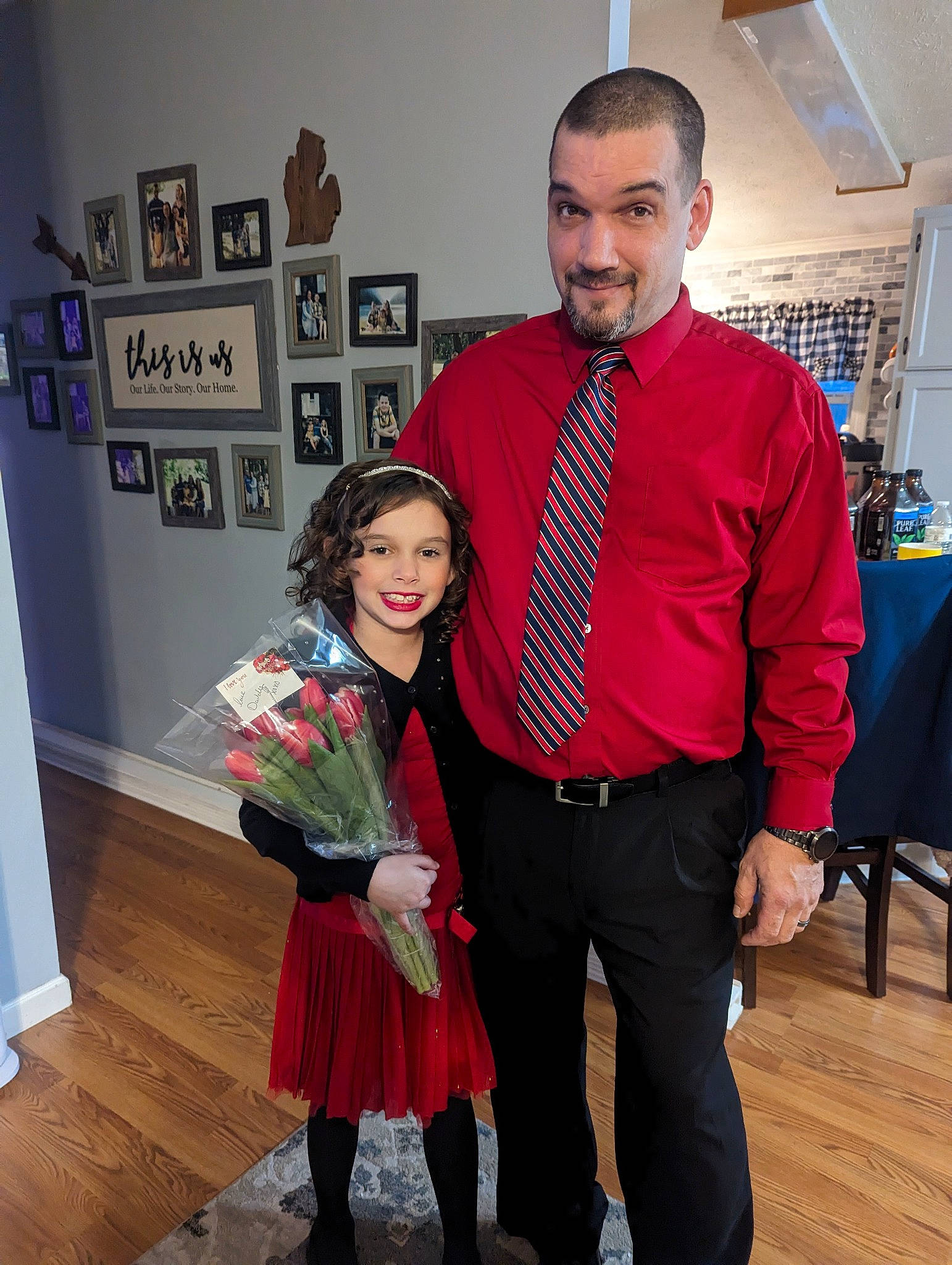 Makenzie joined the competition — help win amazing prizes! belt, chair, costume, dress_shirt, event, eyewear, fashion_accessory, fashion_design, flooring, formal_wear, fun, happy, joy, person, picture_frame, room, shoulder, smile, standing, tie