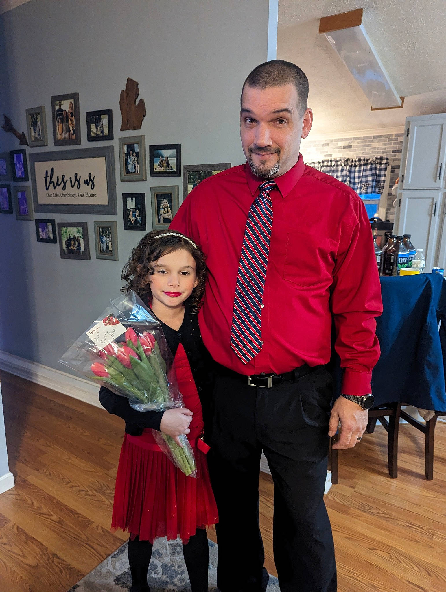 Makenzie is registered to the contest to win money with this photo: belt, chair, child, event, eyewear, fashion_accessory, fashion_design, flooring, formal_wear, fun, happy, joy, magenta, person, picture_frame, room, smile, tie, tradition, wood_flooring