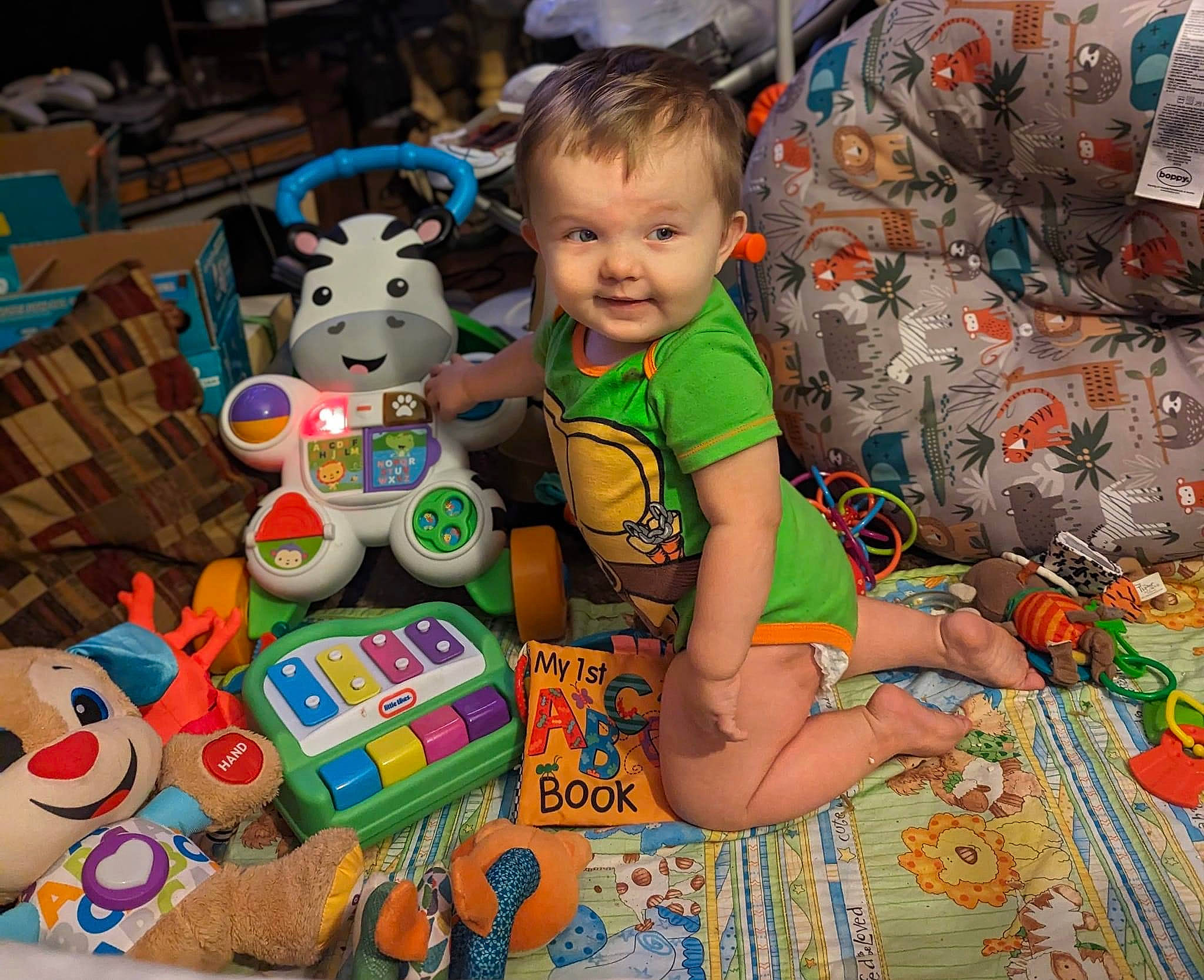 Legend is registered to the contest to win money with this photo: baby, baby_products, baby_toddler_clothing, baby_toys, chair, child, fun, happy, lap, people, person, play, room, sitting, smile, stuffed_toy, t_shirt, textile, toddler, toy