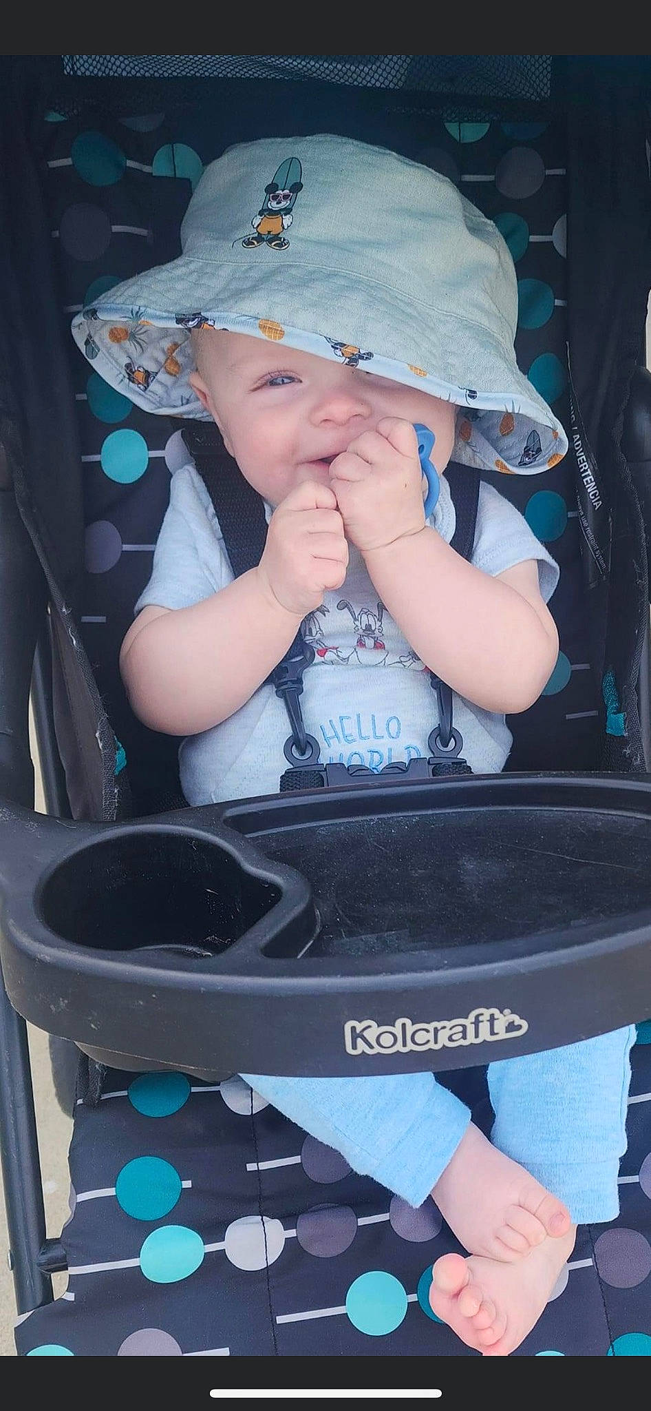 Aaron is registered to the contest to win money with this photo: auto_part, baby, baby_carriage, baby_products, baby_safety, baby_toddler_clothing, baseball_cap, black, blue, cap, carmine, child, cool, electric_blue, fashion_accessory, headwear, person, photograph, product, snapshot