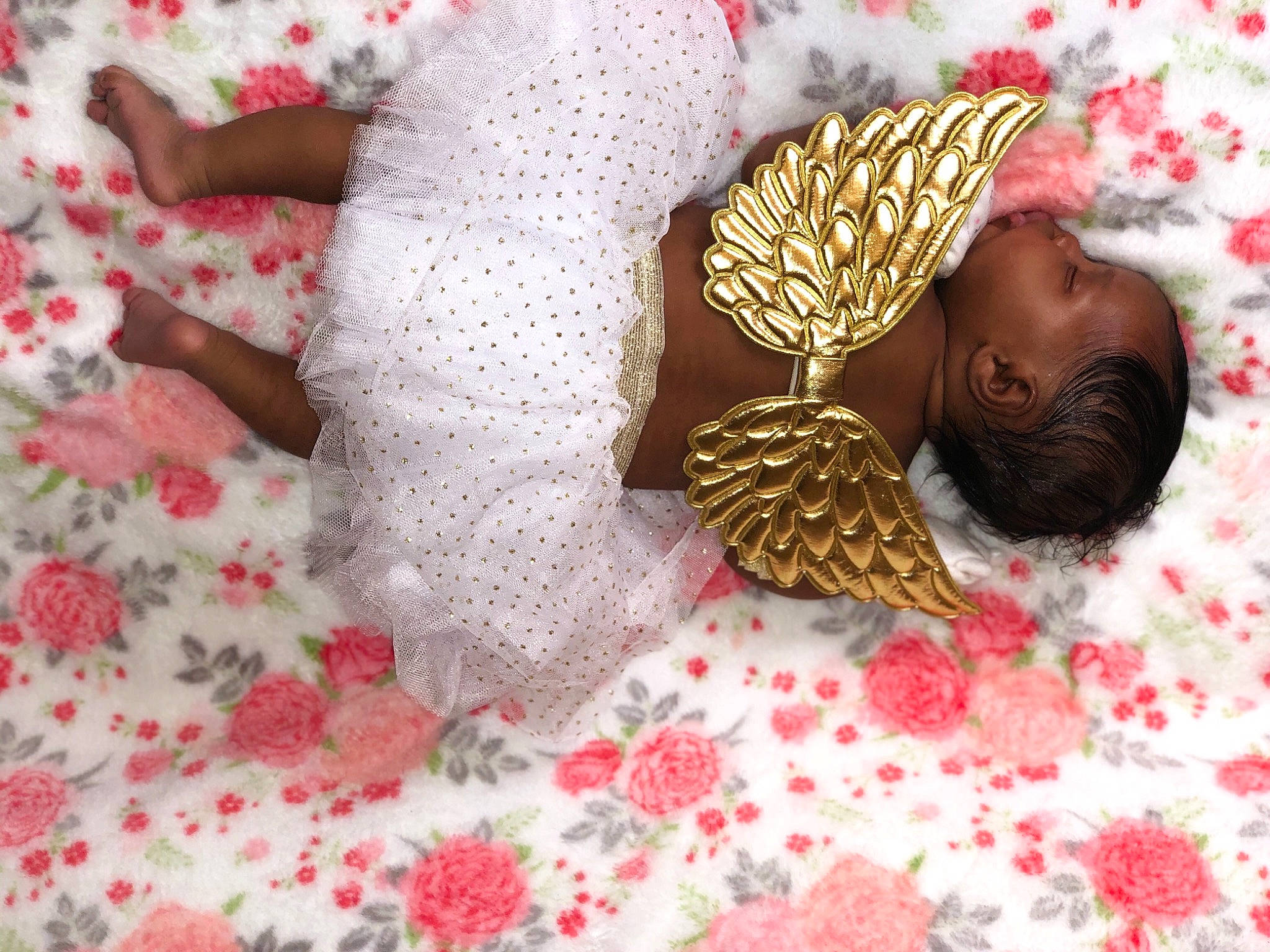 Imani is registered to the contest to win money with this photo: bed_sheet, bedding, child, comfort, costume_hat, craft, fashion_accessory, linens, metal, moths_and_butterflies, ornament, pattern, person, petal, pollinator, room, toy, wing, wood, wool