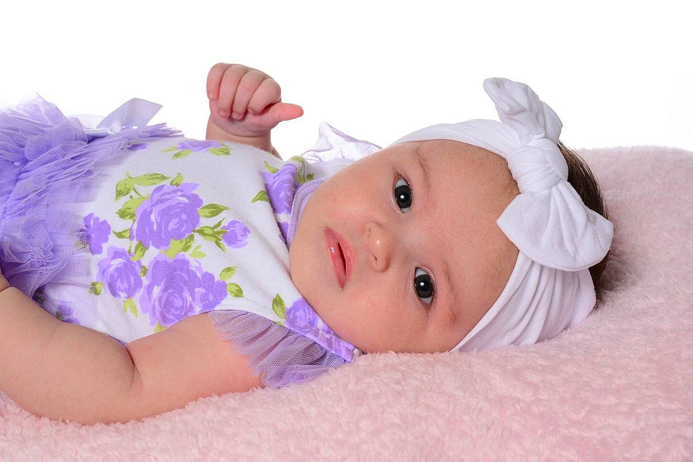 Lainey joined the competition — help win amazing prizes! baby, baby_toddler_clothing, child, comfort, eye, finger, grass, happy, headwear, human_body, iris, linens, magenta, person, petal, pink, purple, skin, sleeve, textile