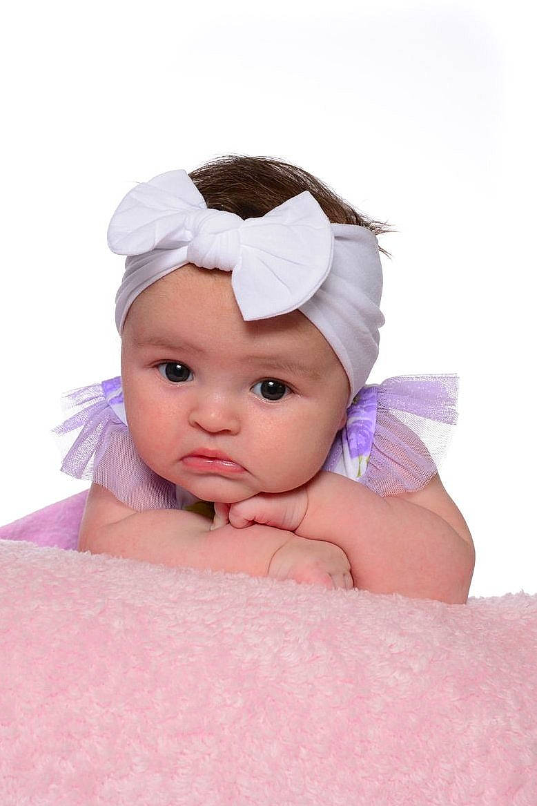 Lainey is registered to the contest to win money with this photo: baby, baby_toddler_clothing, cap, child, comfort, costume_accessory, fashion_accessory, flash_photography, fun, hair_accessory, happy, headgear, headpiece, headwear, linens, magenta, peach, person, photo_shoot, portrait_photography