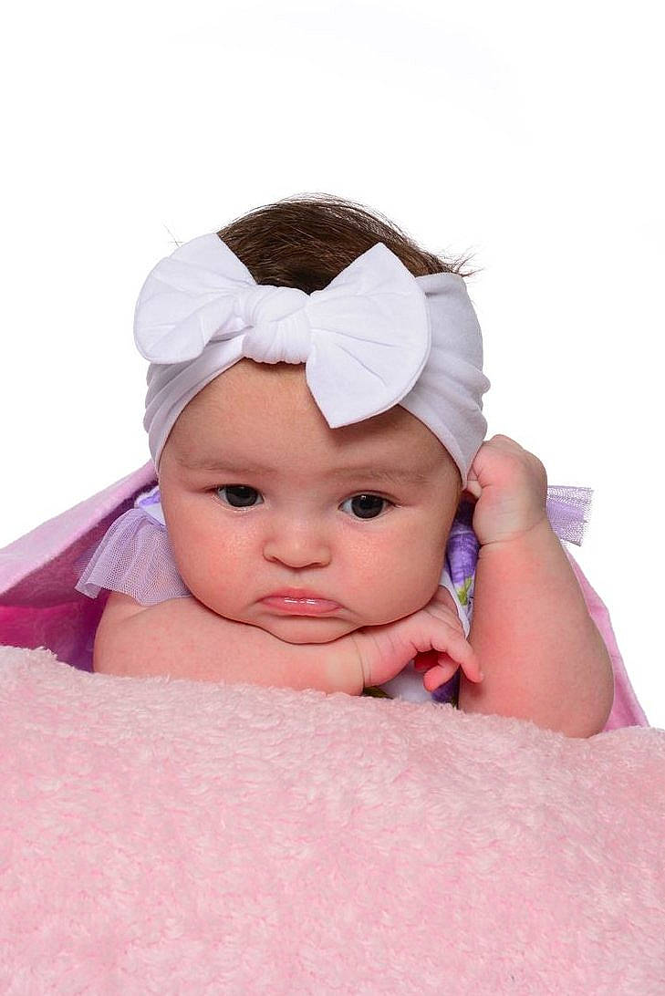 Lainey joined the competition — help win amazing prizes! baby, baby_toddler_clothing, beanie, cap, cheek, child, comfort, eyebrow, fashion_accessory, hair_accessory, happy, headgear, headwear, knit_cap, linens, magenta, peach, person, pink, skin