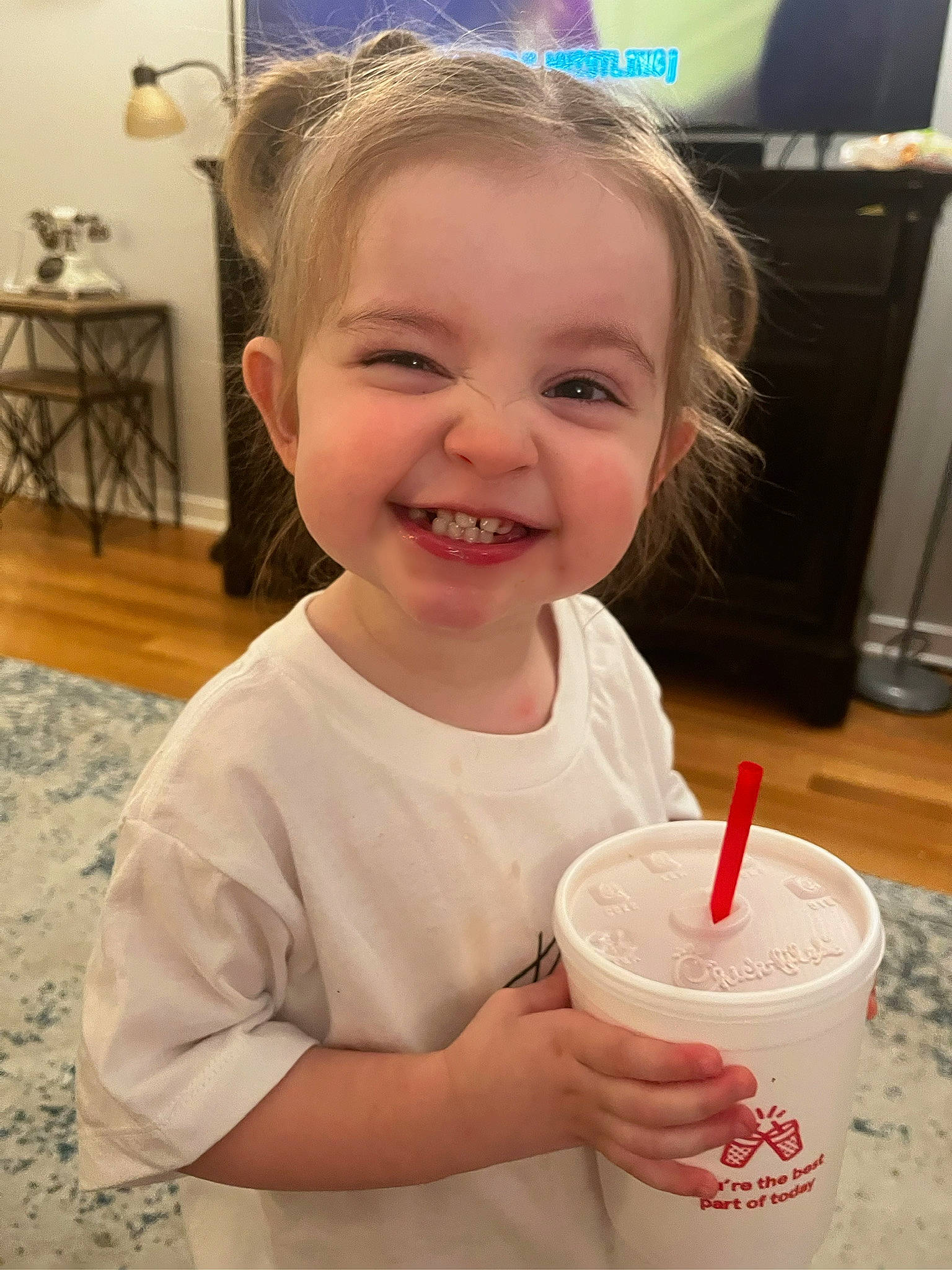 Eden joined the competition — help win amazing prizes! baby_toddler_clothing, cheek, child, cup, drink, drinking, drinking_straw, drinkware, flooring, fun, happy, joy, non_alcoholic_beverage, person, picture_frame, play, skin, smile, stool, t_shirt