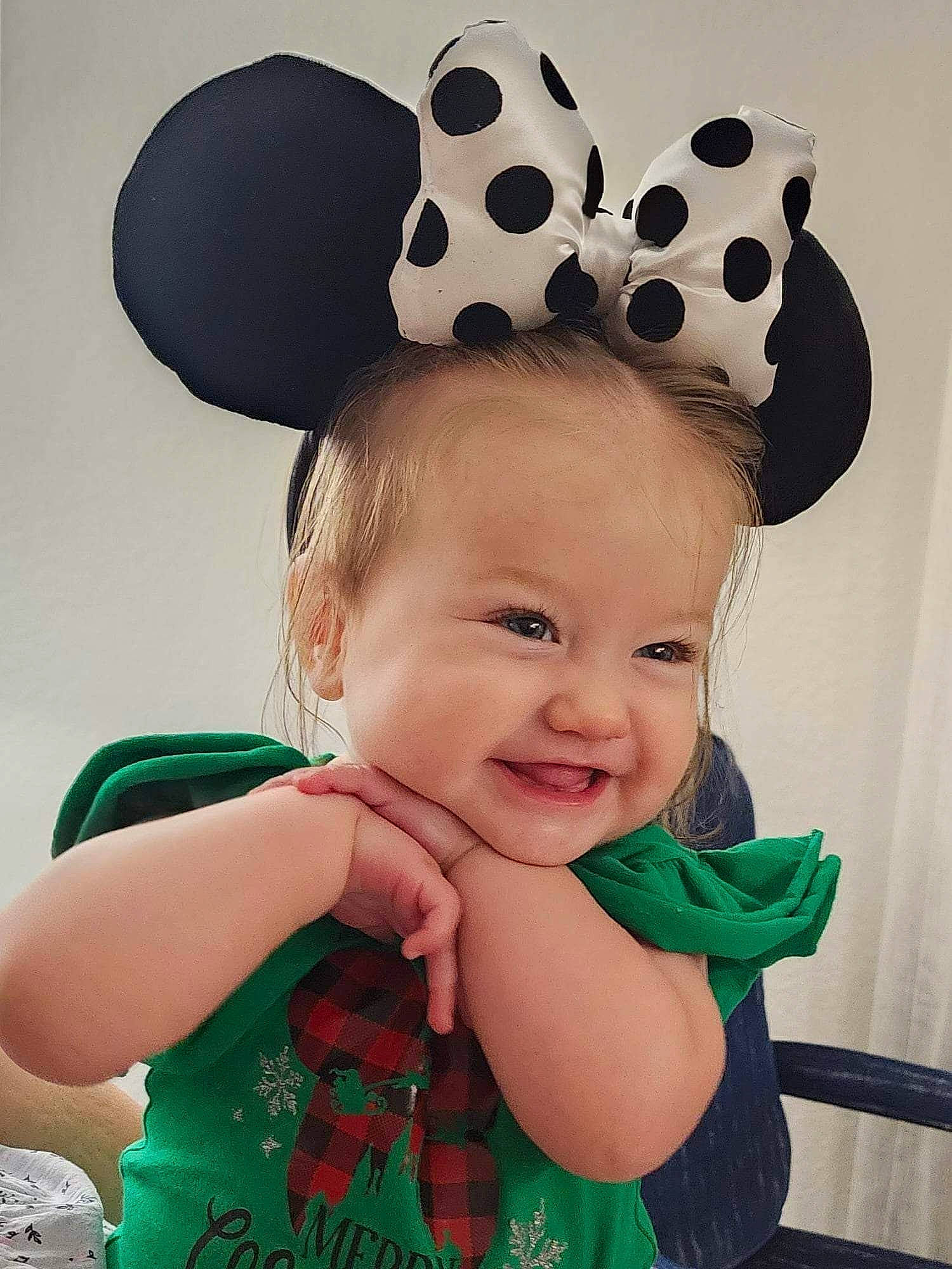 Madilynn is registered to the contest to win money with this photo: baby_toddler_clothing, beauty, cool, costume_hat, face, facial_expression, green, hairstyle, happy, hat, head, headgear, joy, pattern, person, photograph, pink, skin, sleeve, smile