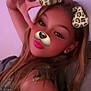 casual_clothing, child, digital_filter, dog_filter, earrings, face, fun, girl, hand_gesture, indoor, leopard_print, long_hair, peace_sign, pink_lighting, playful, portrait, pose, selfie, smiling, young_person