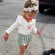Kiana joined the competition — help win amazing prizes! child, toddler, girl, headband, bow, white_shirt, ruffle_shorts, green_shorts, sandals, parking_lot, pavement, car, suv, walking, cute, outdoor, candid, hair, smile, adult_shoe