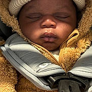 Kaileb joined the competition — help win amazing prizes! baby, sleeping, car_seat, hat, coat, zipper, fur, child, face, closeup, bundle, warm, straps, peaceful, infant, clothing, seatbelt, portrait, cute, indoors