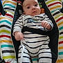 baby, infant, child, onesie, stripes, bouncer, car_seat, harness, winnie_the_pooh, face, eyes, hands, sitting, patterned_cushion, colorful, striped_pattern, plush_toy, portrait, home_interior, photography