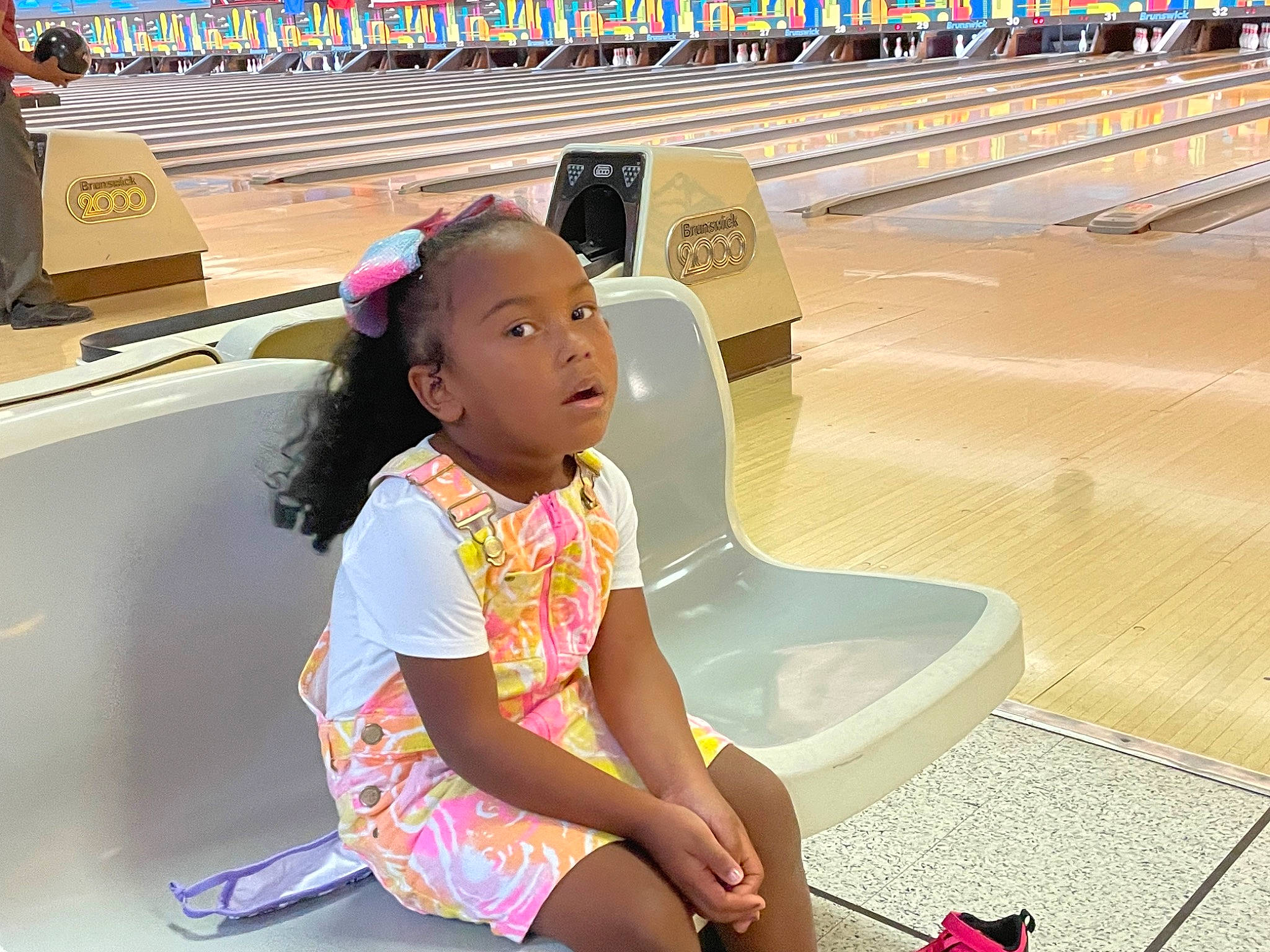Nebula is registered to the contest to win money with this photo: ball, bowling, bowling_ball, bowling_equipment, bowling_pin, child, cool, flooring, fun, happy, human_leg, leisure, person, recreation, sitting, snapshot, sports, ten_pin_bowling, thigh, toddler