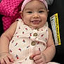 Ariyah Kassing joined the competition — help win amazing prizes! baby, blanket, buttoned_clothing, casual, child, closeup, cute, floral_pattern, happy, headband, indoors, infant, person, pink, portrait, seat, smiling, soft_lighting, tongue_out, warning_label