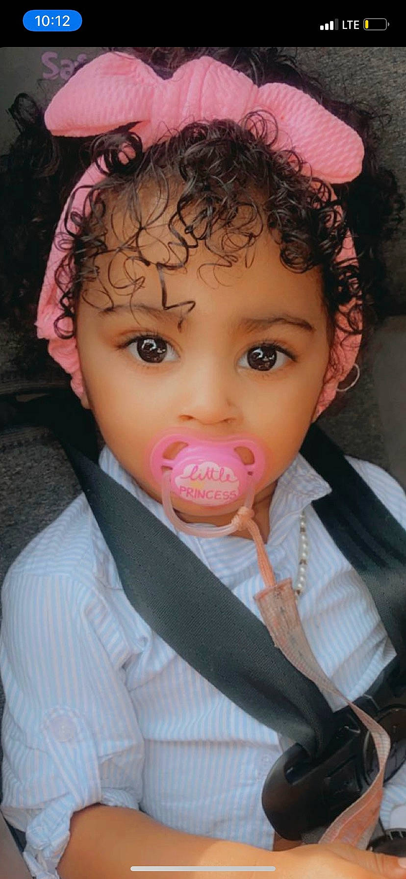 Aaliyah is registered to the contest to win money with this photo: audio_equipment, black_hair, cheek, chin, ear, eyebrow, eyelash, facial_expression, forehead, happy, human_body, iris, jaw, lip, mouth, neck, nose, outerwear, person, pink