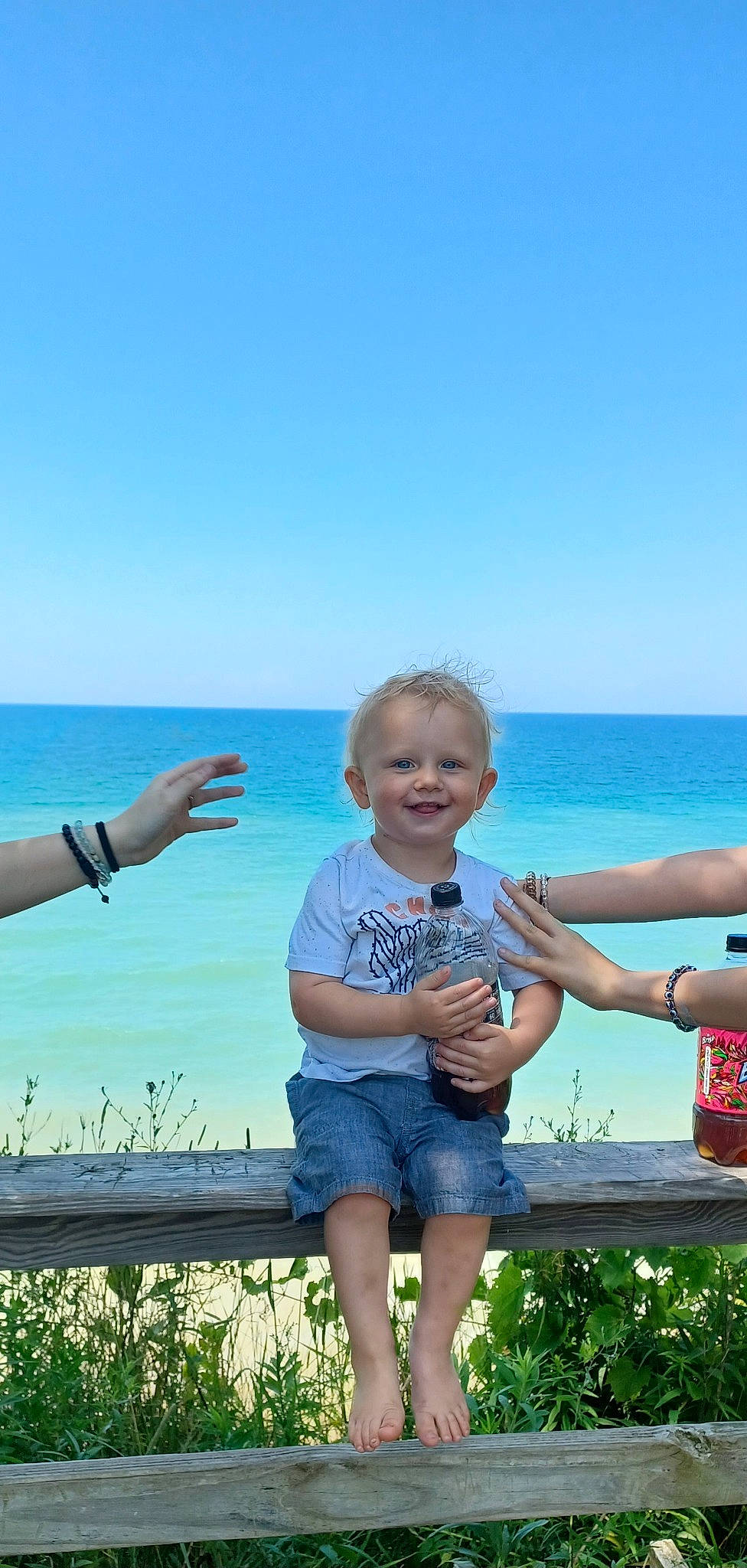 Kendrick joined the competition — help win amazing prizes! azure, baby_toddler_clothing, beach, fun, gesture, grass, green, happy, holiday, horizon, joy, leisure, ocean, people_in_nature, person, plant, sky, smile, thumb, toddler