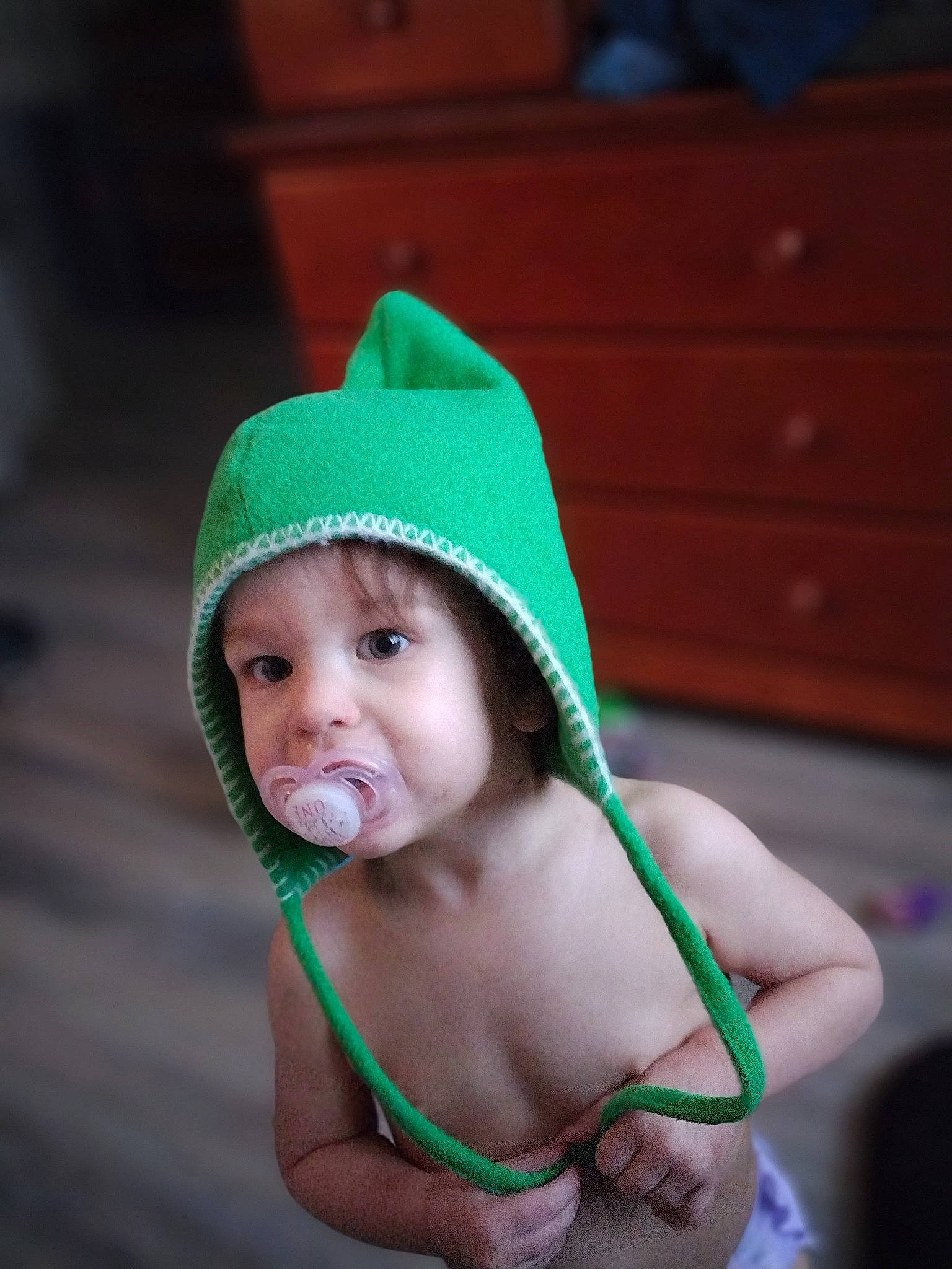 Arilyn is registered to the contest to win money with this photo: baby, beanie, cap, chest, child, event, eye, face, fashion_accessory, fun, grass, happy, headwear, holiday, jewellery, knit_cap, leisure, person, plant, sun_hat