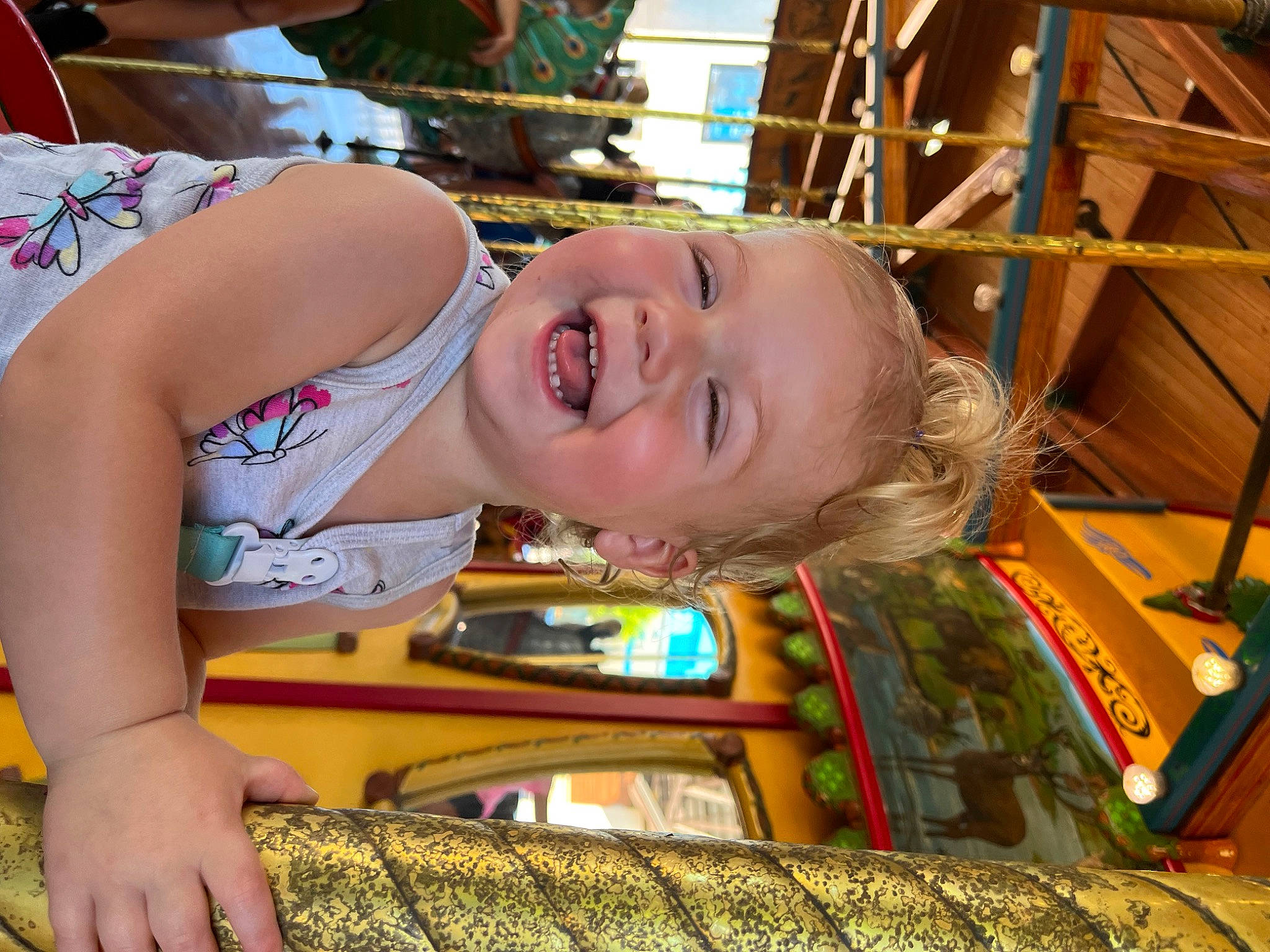Raelynn is registered to the contest to win money with this photo: amusement_ride, baby, child, city, facial_expression, fun, grass, happy, laugh, leisure, mouth, person, play, product, public_space, recreation, skin, smile, toddler, vacation
