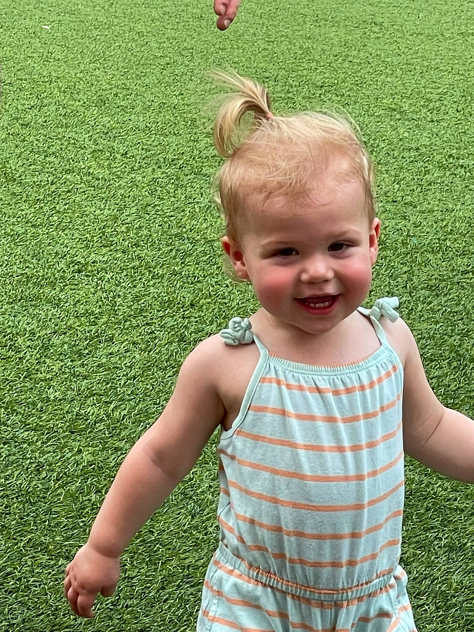 Raelynn joined the competition — help win amazing prizes! baby, baby_toddler_clothing, finger, fun, gesture, grass, grassland, green, happy, joint, joy, mammal, meadow, people_in_nature, person, plant, skin, sleeve, smile, summer