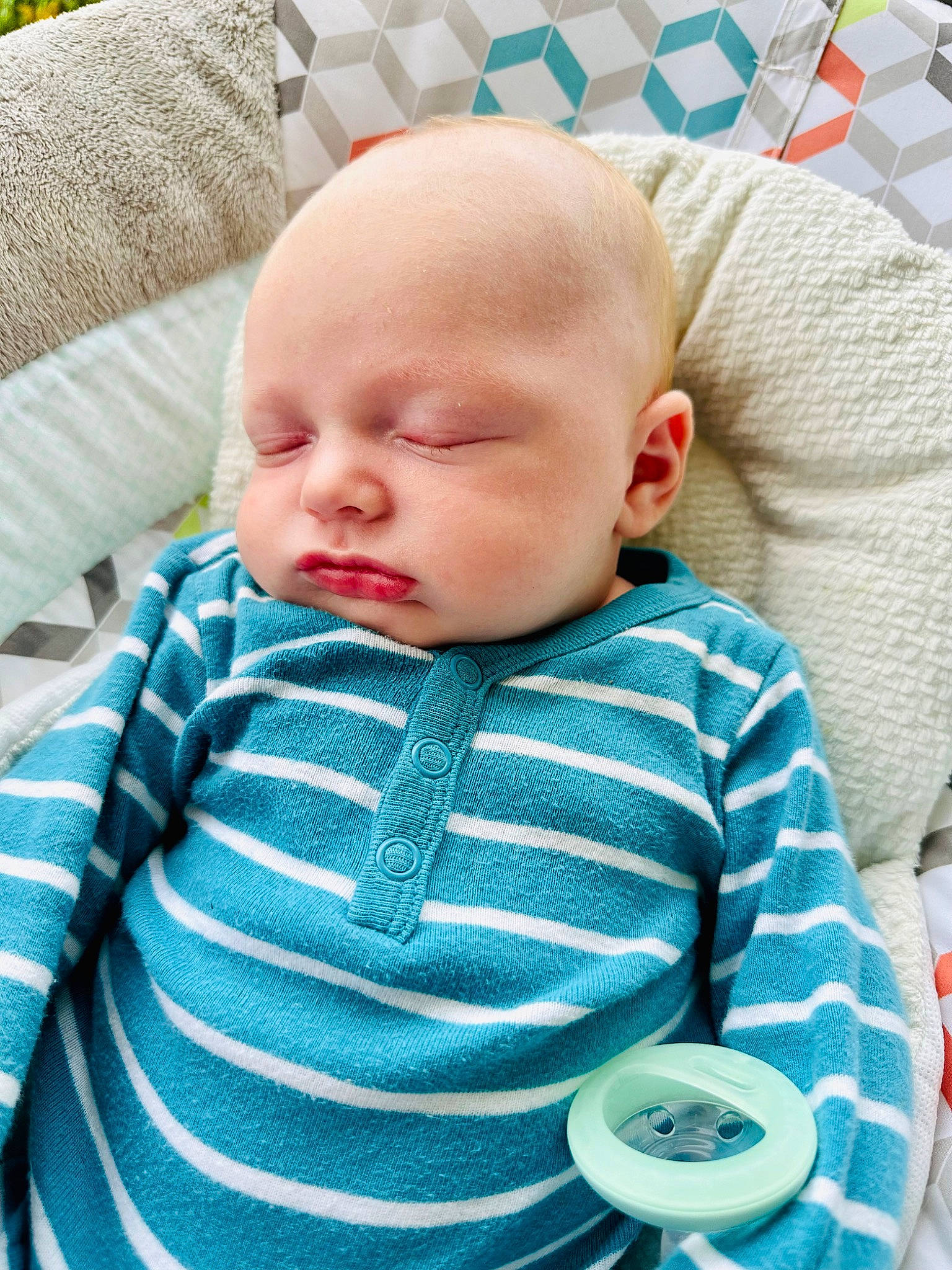 Jaxon joined the competition — help win amazing prizes! baby, baby_products, baby_toddler_clothing, cheek, child, comfort, electric_blue, grass, green, head, iris, linens, pattern, person, room, sitting, skin, sleeve, textile, toddler