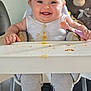 Bonnie-Mae joined the competition — help win amazing prizes! baby, high_chair, smiling, messy_face, spoon, white_shirt, teddy_bear, toy, indoor, cute, child, happy, feeding_time, legs, feet, floor, furniture, home, portrait, infant