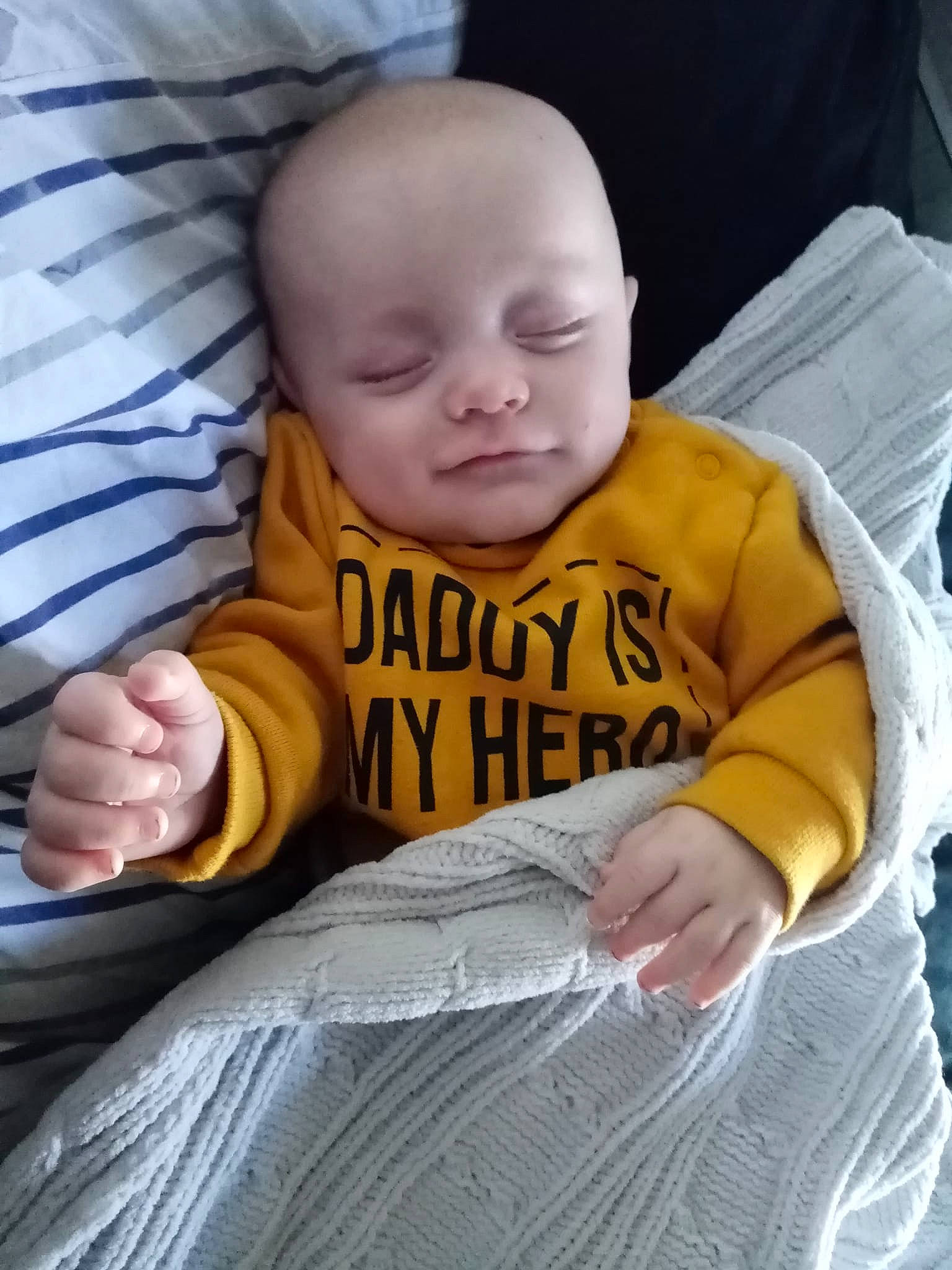 Samuel Scott is registered to the contest to win money with this photo: arm, baby, baby_toddler_clothing, cheek, comfort, finger, gesture, hairstyle, hand, happy, mammal, mouth, nose, person, product, skin, sleeve, t_shirt, thumb, toddler