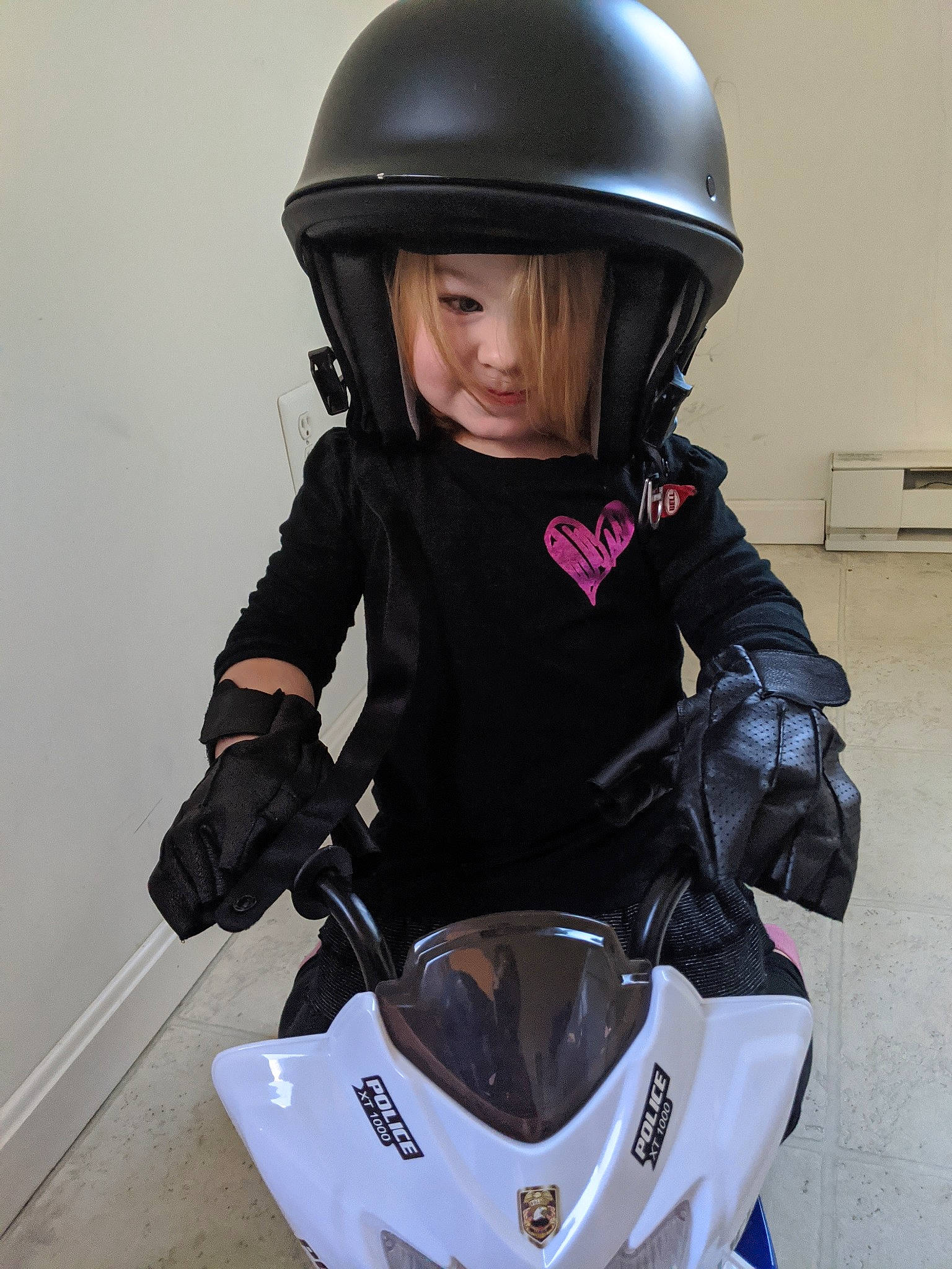 Alexis joined the competition — help win amazing prizes! child, headgear, headwear, helmet, jacket, motorcycle_accessories, motorcycle_helmet, person, personal_protective_equipment, sports_equipment, toddler, vehicle