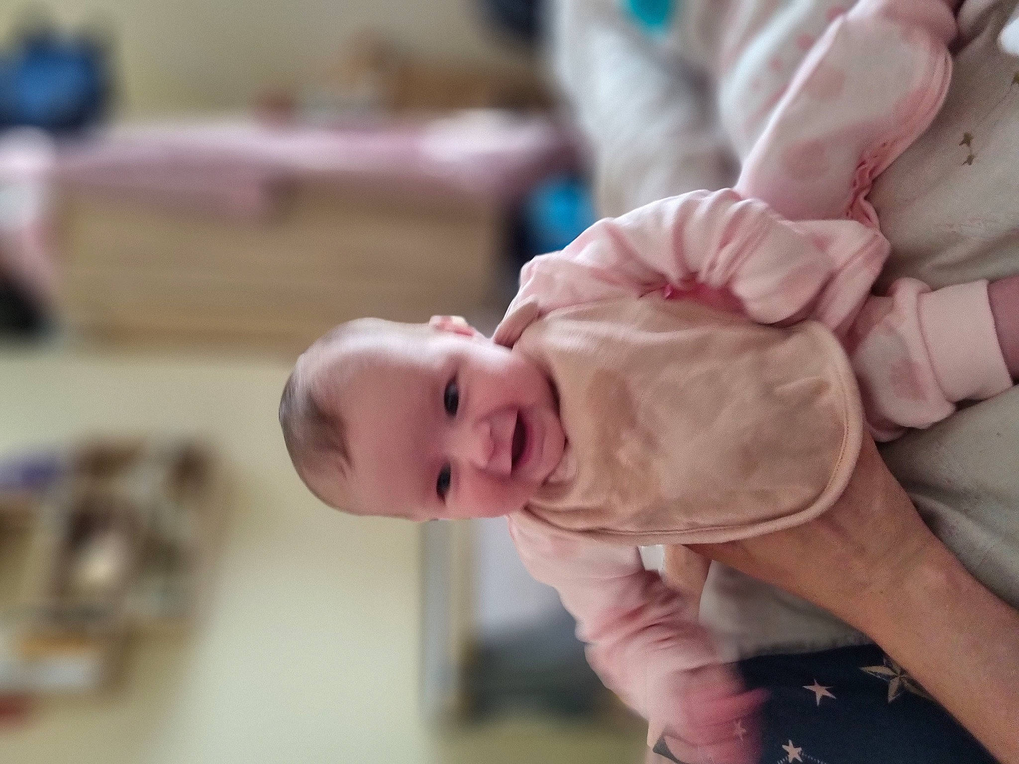 Hallie joined the competition — help win amazing prizes! baby, baby_products, baby_toddler_clothing, cheek, child, comfort, eye, fun, gesture, hand, happy, joy, laugh, nose, person, room, sitting, sleeve, smile, thumb