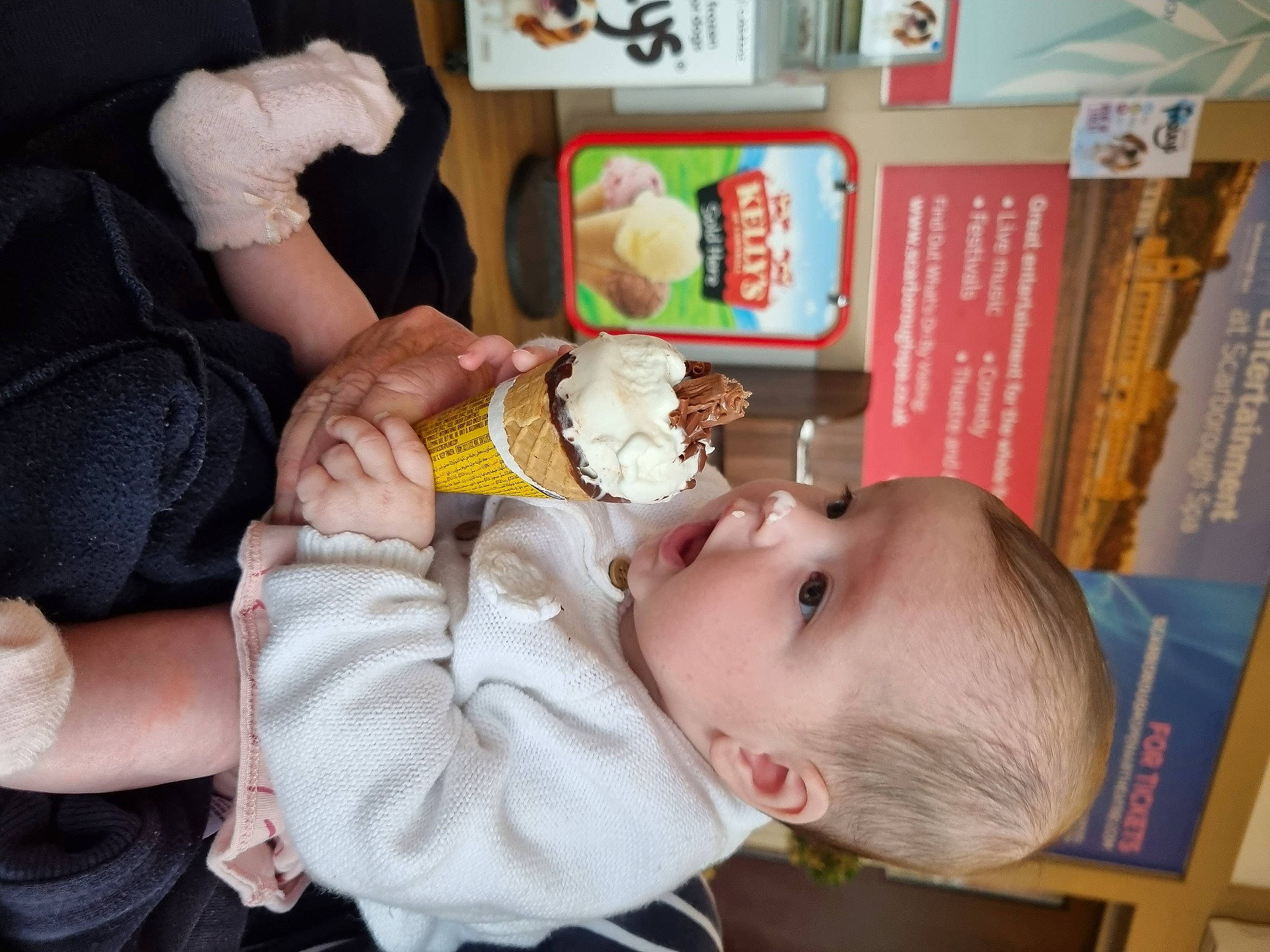 Hallie is registered to the contest to win money with this photo: baby, baby_products, baby_safety, baby_toddler_clothing, bookcase, child, comfort_food, happy, nail, person, play, publication, room, shelf, shelving, stuffed_toy, sweetness, toddler, toy, wrist